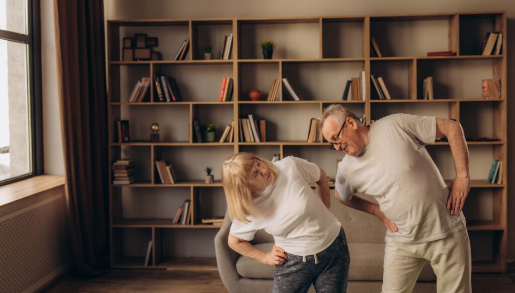 Elderly couple doing movement to prevent arthritis. Pain from arthritis responds to movement and heat.