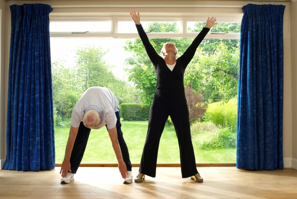 Older couple enjoying the increased movement after chiropractic massage. Mindful movement prevents injury to joints and muscles.