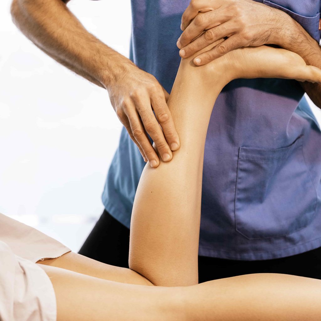 image of Chiropractic massage to increase blood flow and move lymph fluid in patient's lower leg